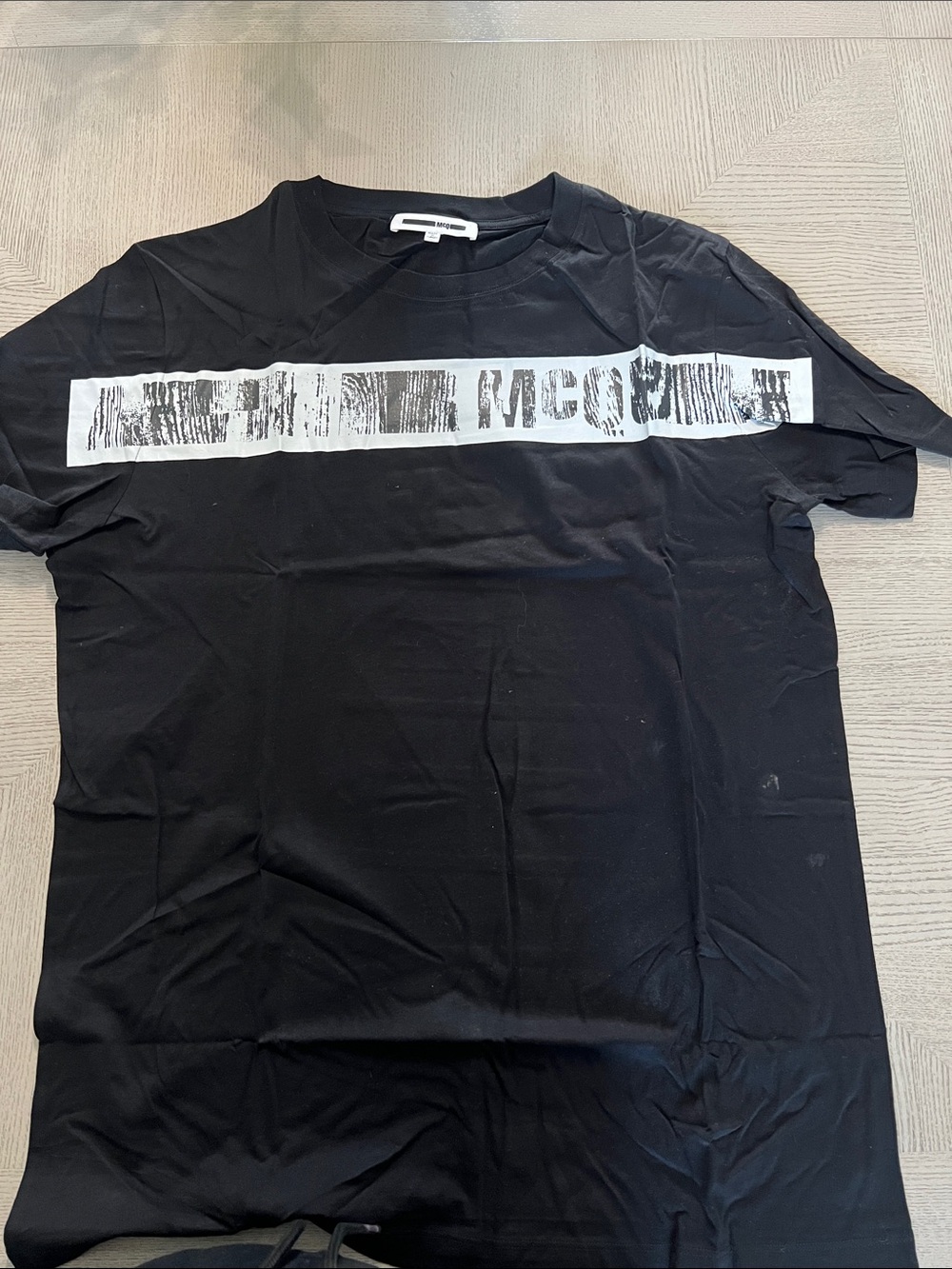McQ by Alexander McQueen Black Tee with White Distressed Chest Stripe